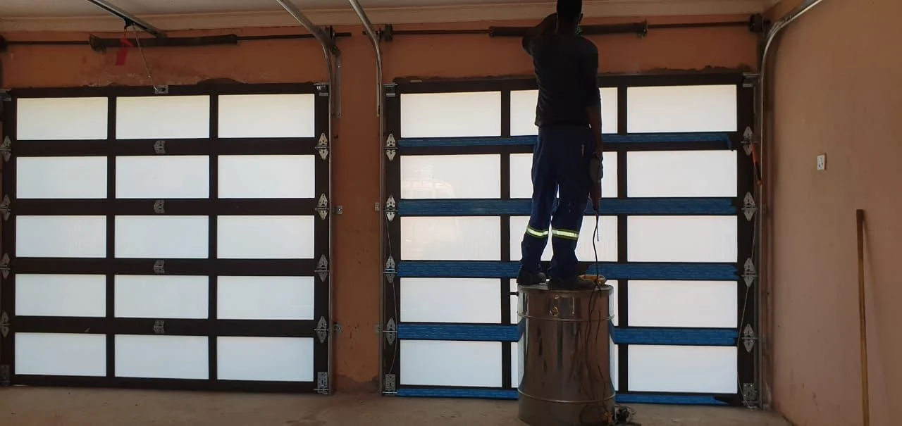 Glazed garage door systems